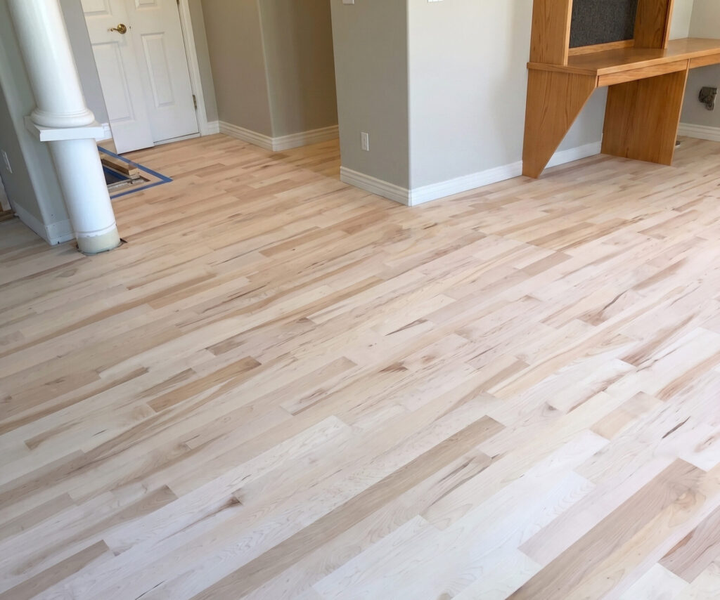 Freshly sanded natural oak hardwood floor in a living area