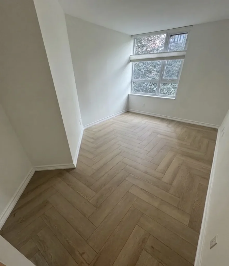 Herringbone laminate floor installed by 22FLOORING in Toronto